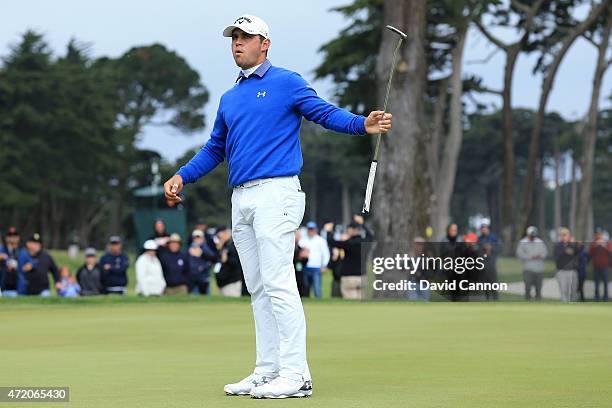 Gary Woodland reacts after making a birdie putt on the 16th hole green to win his semi final match 3&2 over Danny Willett of England in the World...