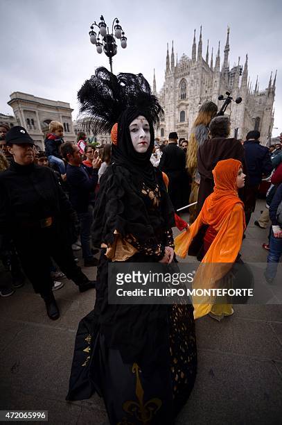 Cosplayer dressed as Padme Amidala of "Star Wars" stands in front of Milan's Duomo on May 3, 2015 as part of Star Wars Day. AFP PHOTO / FILIPPO...