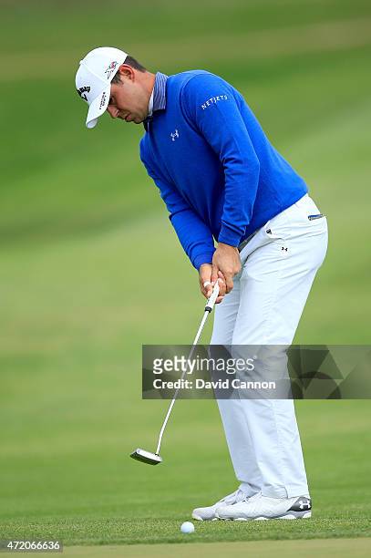 Gary Woodland of the USA hits a putt on the par 4, 15th hole during his semi final match in the World Golf Championships Cadillac Match Play at TPC...