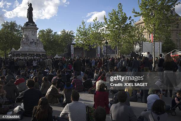 People attend a free concert organized to celebrate the World press freedom day, and the 30th anniversary of Reporters Without Borders association on...