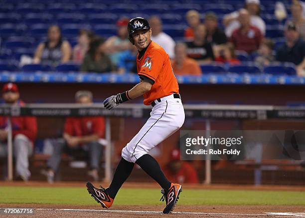 Ichiro Suzuki of the Miami Marlins runs to first base after hitting a foul ball during the first inning of the game against the Philadelphia Phillies...