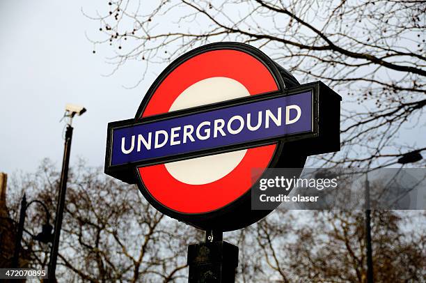 underground sign and surveilance camera - london underground station exterior stock pictures, royalty-free photos & images