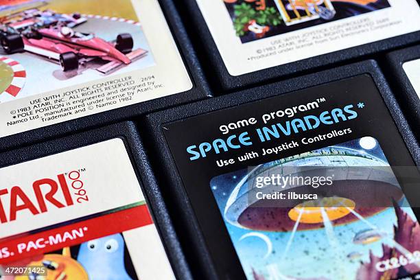 close up on vintage atari 2600 video game cartridges - cartridge stock pictures, royalty-free photos & images