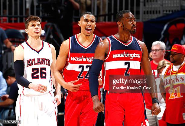 John Wall of the Washington Wizards reacts after assisting on a basket in the final seconds against the Atlanta Hawks during Game One of the Eastern...