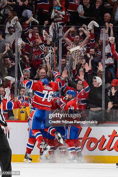 Members of the Canadiens celebrate a goal by Max Pacioretty in Game One of the Eastern Conference Semifinals against the Tampa Bay Lightning during...