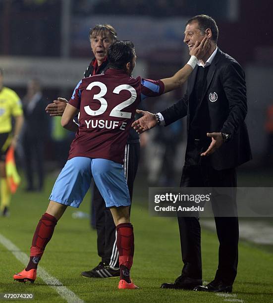 Trabzonspor's Yusuf Erdogan talks to Besiktas' head coach Slaven Bilic during the Turkish Spor Toto Super League soccer match between Trabzonspor and...