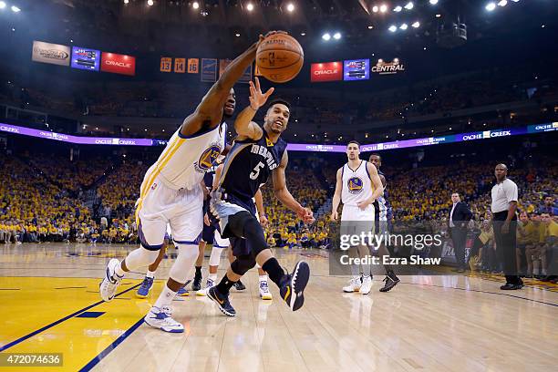 Draymond Green of the Golden State Warriors and Courtney Lee of the Memphis Grizzlies go for a loose ball during Game One of the Western Conference...