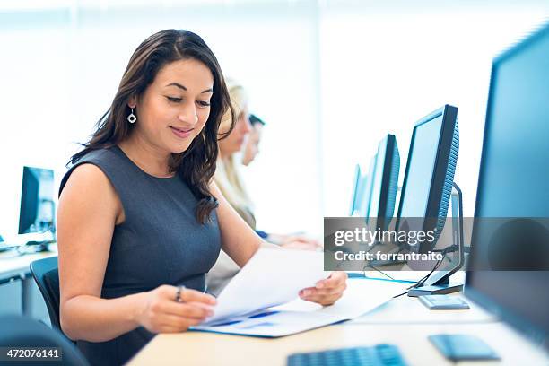 hispanic woman in computer lab - computer training stock pictures, royalty-free photos & images