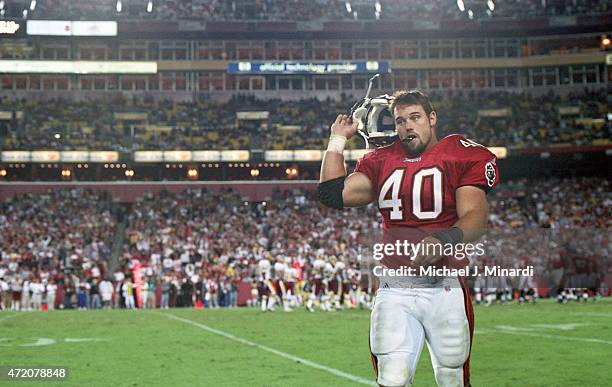 Fullbacker Mike Alstott of the Tampa Bay Buccaneers comes off the field after scoring a few extra yards on the ground duriing a NFL football game...