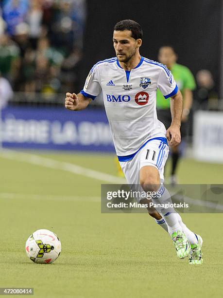 Dilly Duka of the Montreal Impact moves the ball in the 2nd Leg of the CONCACAF Champions League Final against Club America at Olympic Stadium on...