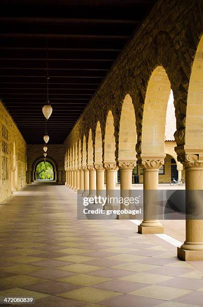empty walkway with columns at stanford university - palo alto stock pictures, royalty-free photos & images