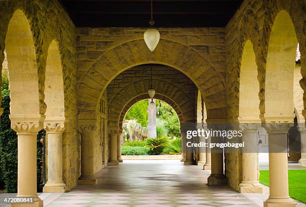 empty walkway with columns at stanford university - palo alto stock pictures, royalty-free photos & images
