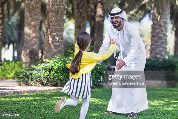 enjoying with her father - arab family happy stock pictures, royalty-free photos & images