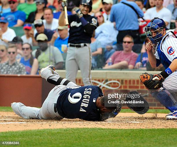 Jean Segura of the Milwaukee Brewers reacts as he's hit by a pitch against the Chicago Cubs during the eighth inning on May 3, 2015 at Wrigley Field...