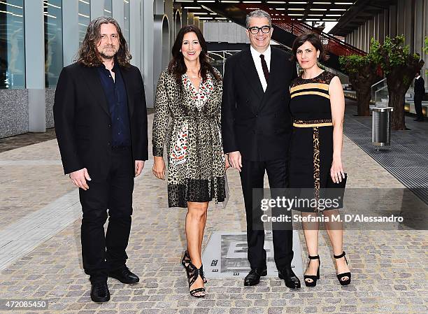 Wade Guyton, Lauren Taschen, Gio Marconi an guest attend the Fondazione Prada Opening on May 3, 2015 in Milan, Italy.