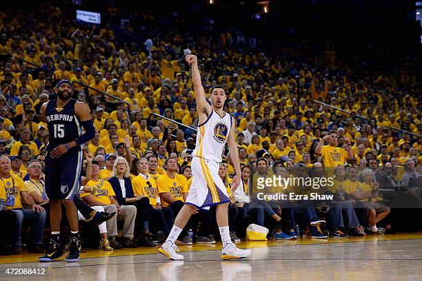 Klay Thompson of the Golden State Warriors watches a three-pointer go through the basket against the Memphis Grizzlies during Game One of the Western...