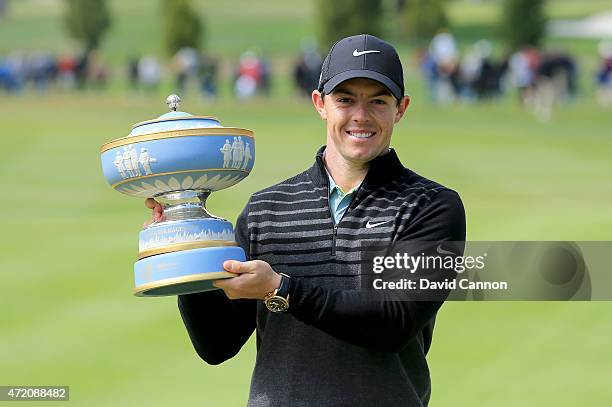 Rory McIlroy of Northern Ireland lifts the Walter Hagen Cup after defeating Gary Woodland 4&2 in the championship match of the World Golf...