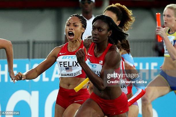 Allyson Felix hands the baton to Kimberlyn Duncan of the United States during round one of the womens 4 x 100 metres on day two of the IAAF/BTC...