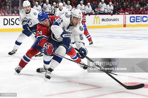 Alexei Emelin of the Montreal Canadiens tries to reach the puck against Valtteri Filppula of the Tampa Bay Lightning in Game 2 of the Eastern...