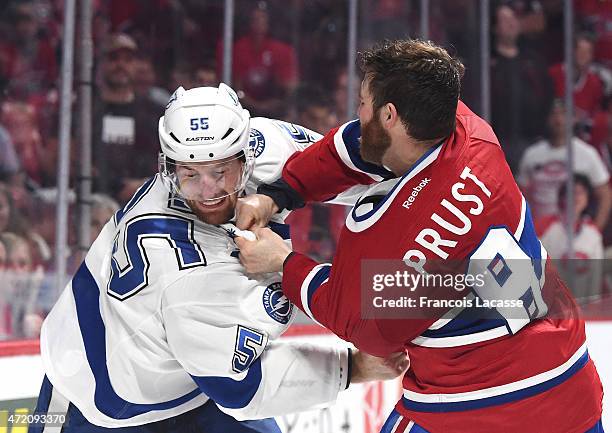 Brandon Prust of the Montreal Canadiens fights with Braydon Coburn of the Tampa Bay Lightning in Game 2 of the Eastern Conference Semifinals during...