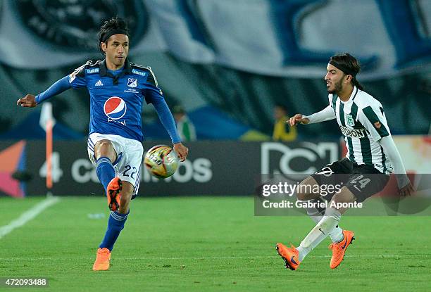 Fabian Vargas of Millonarios struggles for the ball with Sebastian Perez of Atletico Nacional during a match between Millonarios and Atletico...