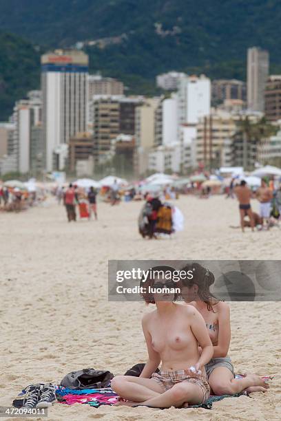 topless in ipanema beach - bare beach stock pictures, royalty-free photos & images