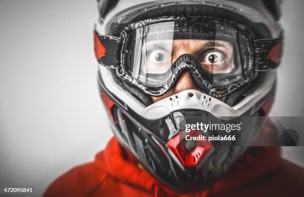 scared motocross motorbike rider with helmet - helmet stock pictures, royalty-free photos & images