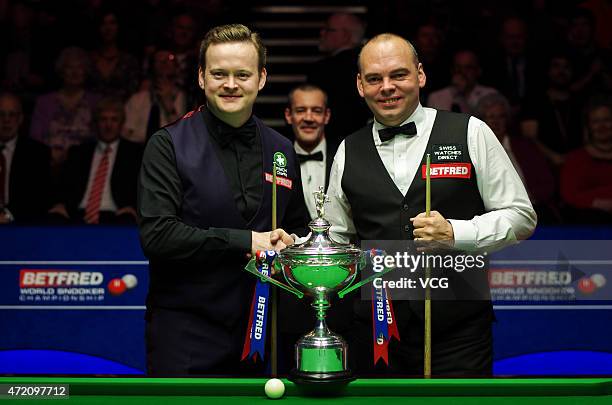 Shaun Murphy of England shake hands with Stuart Bingham of England during the final match on day sixteen of the 2015 Betfred World Snooker...