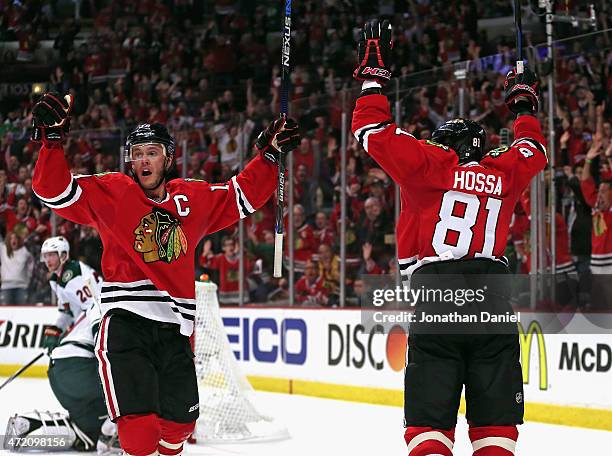 Jonathan Toews and Marian Hossa of the Chicago Blackhawks celebrate Toews' second period goal against the Minnesota Wild in Game Two of the Western...