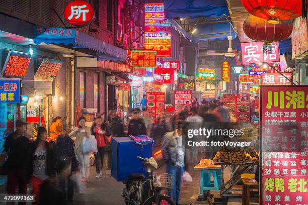 china restaurants and night markets illuminated in crowded beijing streets - street market stock pictures, royalty-free photos & images