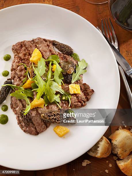 grilled steak with mushrooms and arugula - morel mushroom stock pictures, royalty-free photos & images