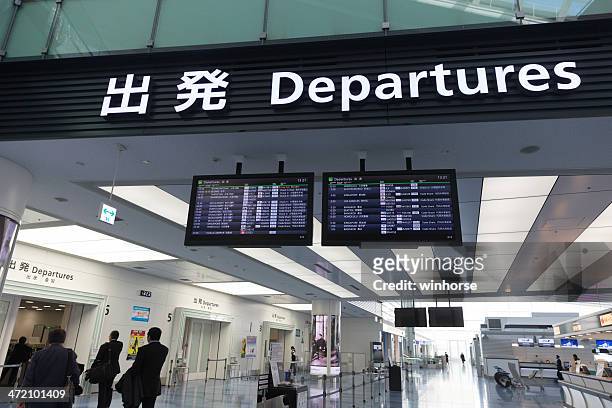departure board in tokyo international airport - tokyo international airport stock pictures, royalty-free photos & images