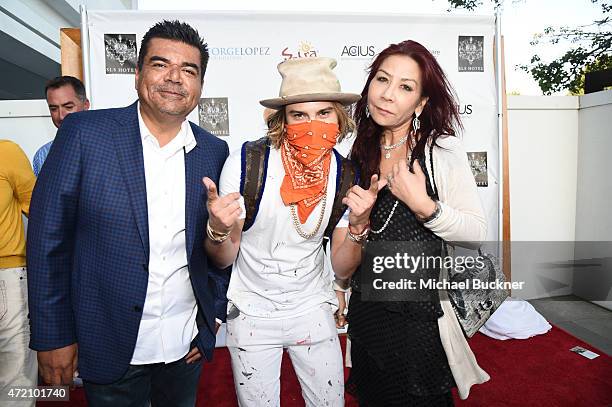 Comedian George Lopez, artist Alec Monopoly and Anna Shay attend the 8th Annual George Lopez Celebrity Golf Classic Pre-Party at the SLS Hotel on May...