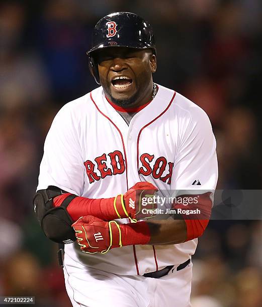 David Ortiz of the Boston Red Sox reacts after making the final out with the bases loaded in the ninth inning against the New York Yankees at Fenway...