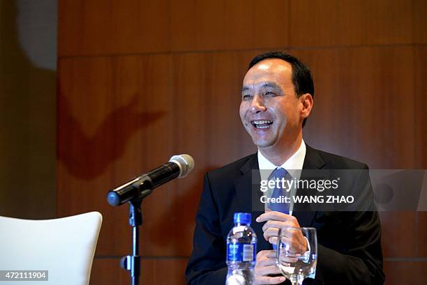 Eric Chu, chairman of Taiwan's ruling Kuomintang party laughs during a press conference at a hotel in Beijing on May 4, 2015. China's Communist Party...