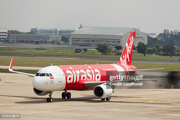 air asia airplane - air asia stock pictures, royalty-free photos & images