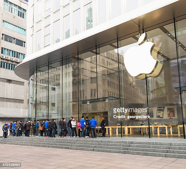 queue outside shanghai's apple store - apple building stock pictures, royalty-free photos & images