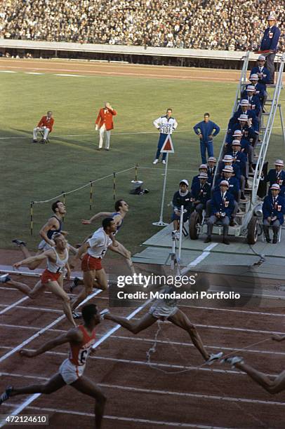 "The arrival of the 200 meter sprinters at the Tokyo XVIII Olympic Games; from the left Sergio Ottolina, Marian Foik, Edwin Roberts, Harry Jerome,...