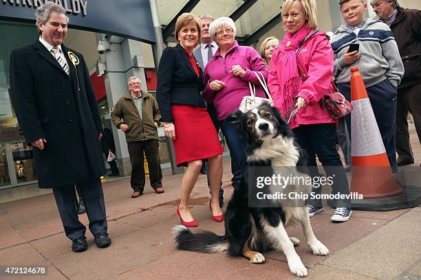 First Minister and leader of the Scottish National Party Nicola Sturgeon poses for photographs with members of the public while campaigning for SNP...