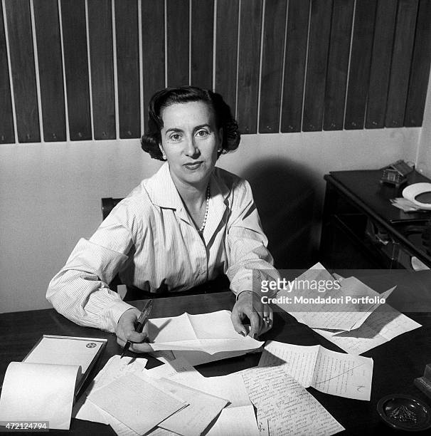 "Camilla Cederna, apreciated journalist and writer, looks straight into the camera, sitting before many handwritten papers; the author has recently...