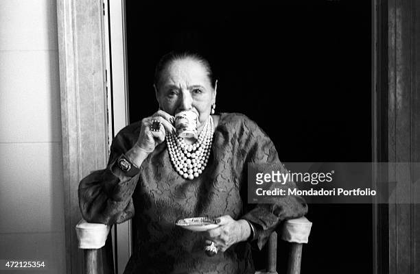 "Polish entrepreneur and founder of the cosmetic company bearing her same name Helena Rubinstein having a cup of coffee. New York, April 1964 "