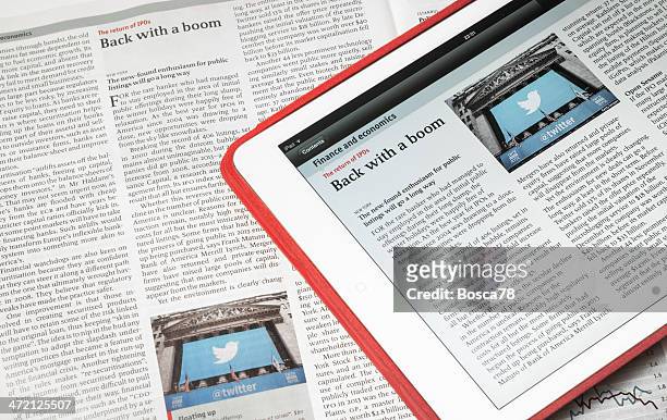 white ipad air and the economist magazine displaying same article - article stock pictures, royalty-free photos & images