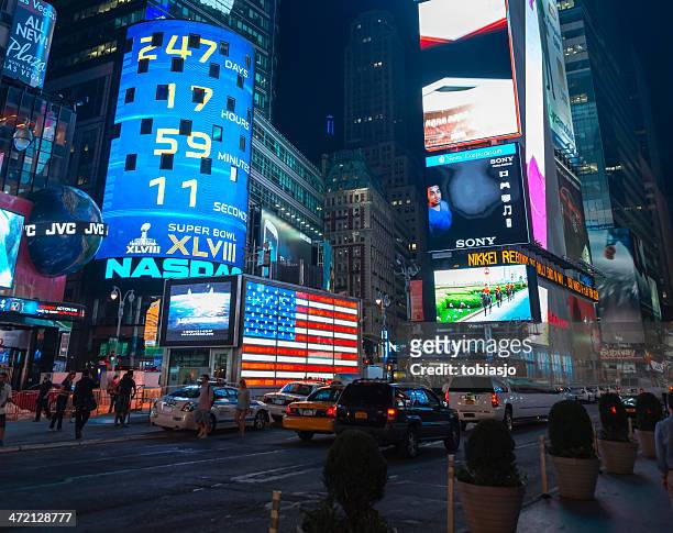 times square manhattan at night - nasdaq stock pictures, royalty-free photos & images