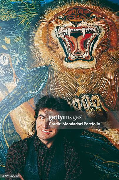 "Italian singer-songwriter Luciano Ligabue posing in front of a work by the painter bearing his same 'Il re della foresta''Il re della foresta'....