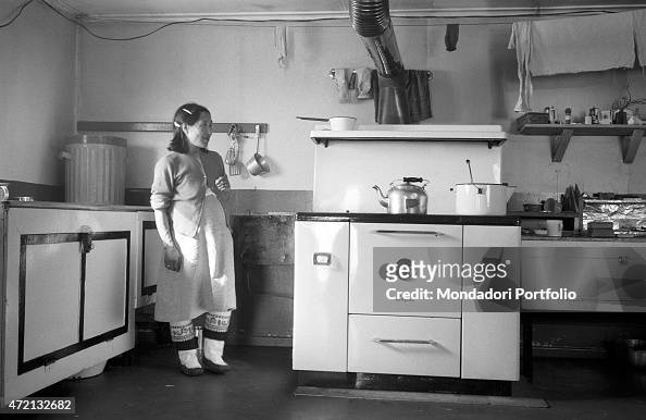 An inuit woman in her kitchen
