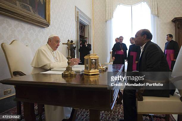 "Pope Francis welcoming the President of the Republic of Tunisia Moncef Marzouki at the private library of the Apostolic Palace. Vatican City, 11th...