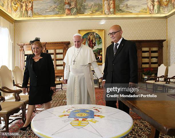 "Pope Francis welcoming the President of the Republic of Malta Marie Louise Coleiro Preca and her husband Edgar Preca at the private library of the...