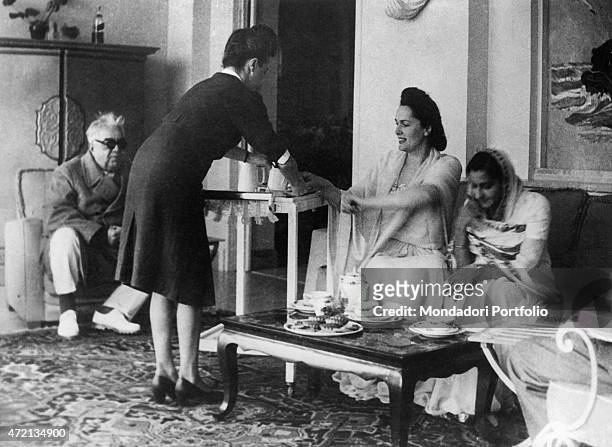 "Imam of the Nizari Ismaili community Aga Khan III receiving an Indian princess with his wife, French model Begum Om Habibeh Aga Khan . 1950s "