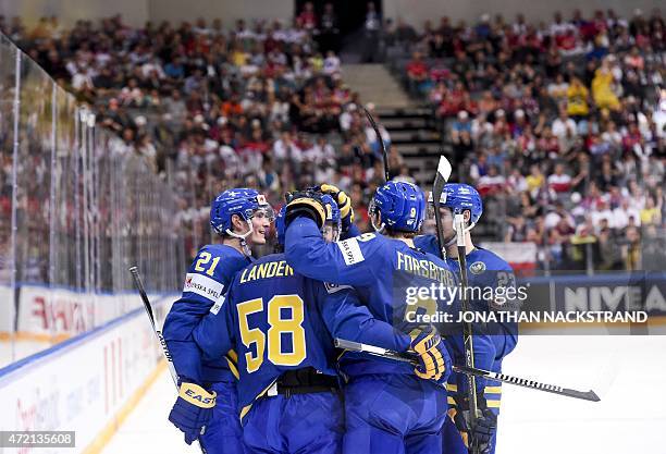 Forward Loui Ericsson of Sweden celebrates with his teammates after scoring a hattrick during the group A preliminary round ice hockey match Latvia...