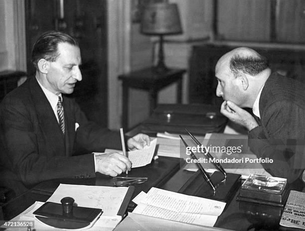 "The President of the Council of Ministers of the Italian Republic Alcide De Gasperi talking to the Minister of the Interior of the Italian Republic...